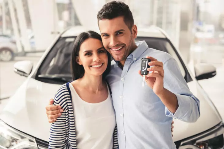 couple picking up a rental car